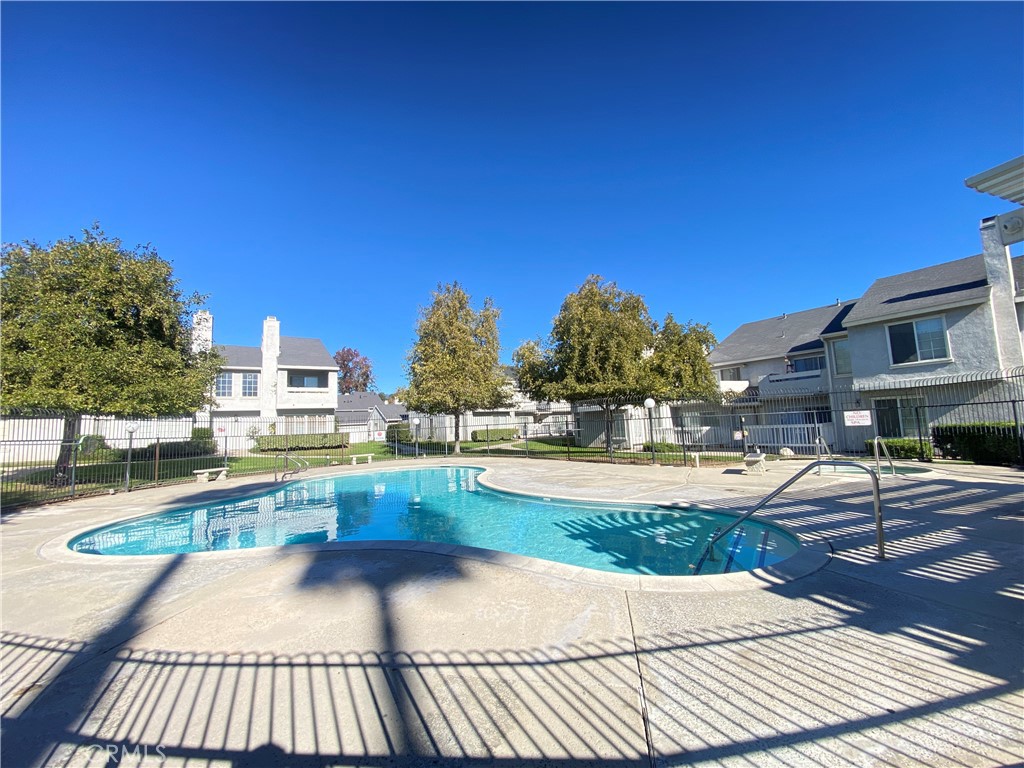 156 West Walnut Avenue, Unit A Rialto, CA 92376 - Photo 28 of 28 a view of a swimming pool with sitting area