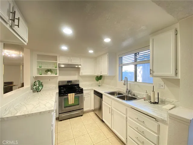 a room with a sink and a mirror