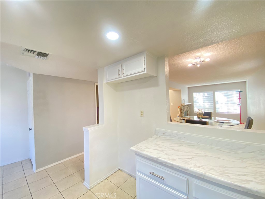 156 West Walnut Avenue, Unit A Rialto, CA 92376 - Photo 8 of 28 a room with a sink and a mirror