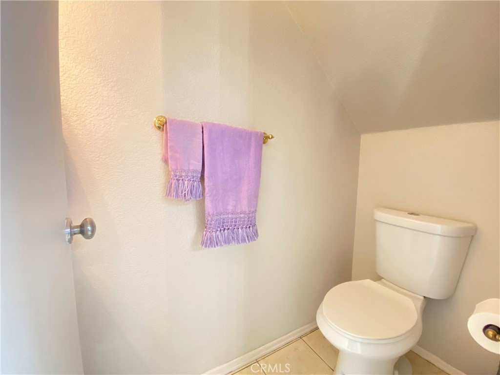 156 West Walnut Avenue, Unit A Rialto, CA 92376 - Photo 10 of 28 a bathroom with a toilet and a sink