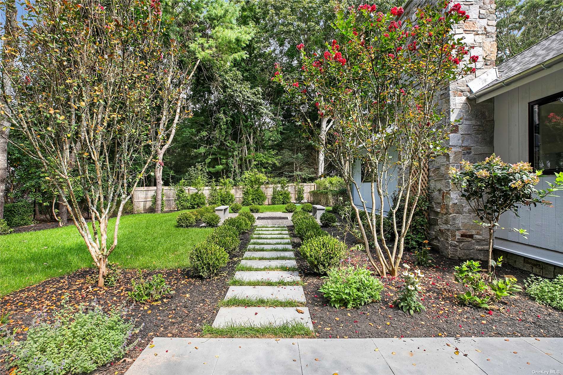 a view of a pathway of flower garden