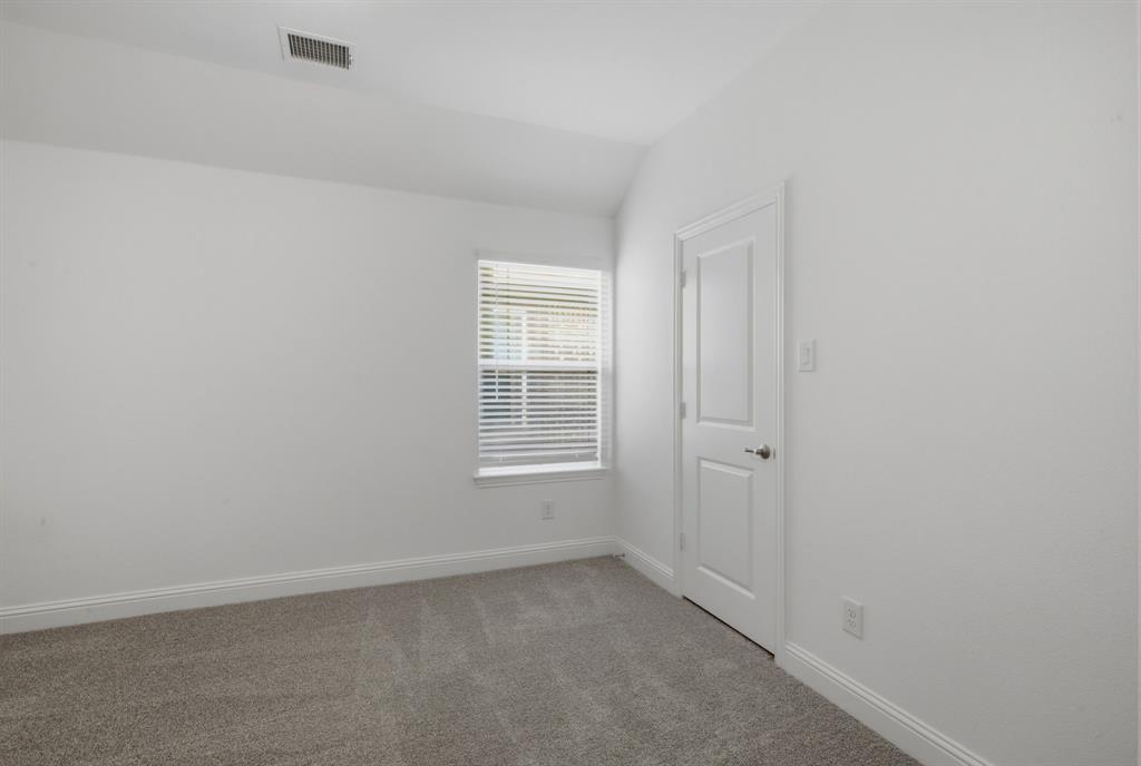 2911 Hanscom Street Forney, TX 75126 - Photo 12 of 40 Neutral-toned carpet flooring, white painted walls, and a window with horizontal blinds
