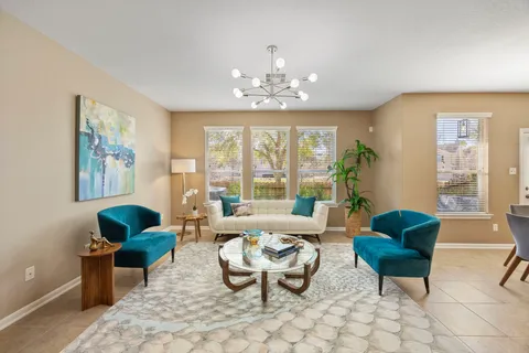 a living room with furniture and a large window