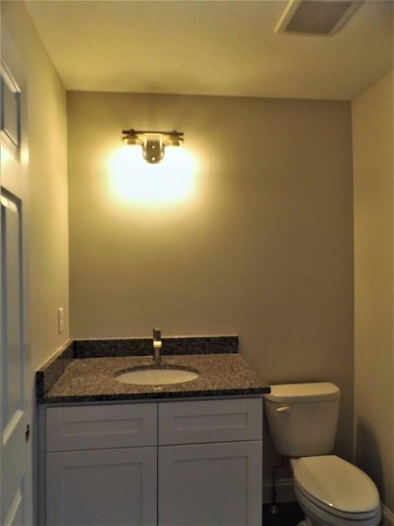 31 Adams Road Athol, MA 01331 - Photo 11 of 26 a bathroom with a granite countertop toilet and a sink