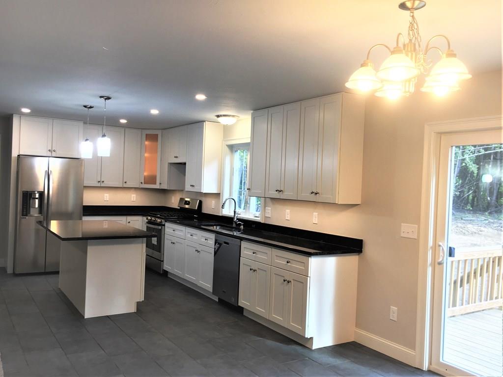 31 Adams Road Athol, MA 01331 - Photo 6 of 26 a kitchen with stainless steel appliances granite countertop a sink a stove and a refrigerator