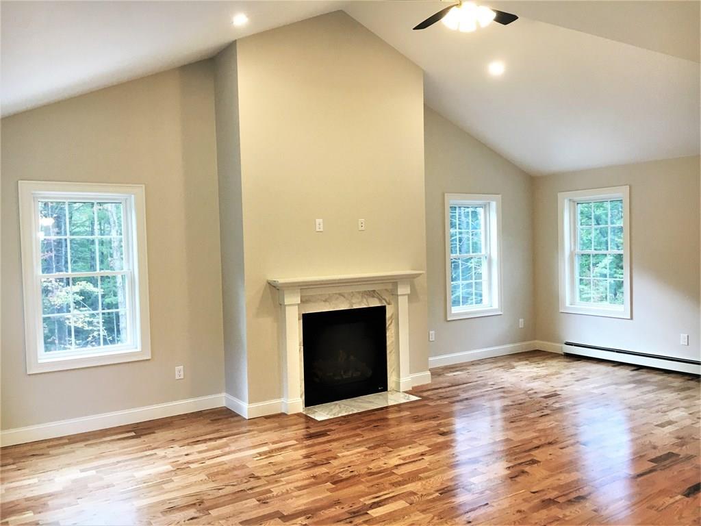 31 Adams Road Athol, MA 01331 - Photo 8 of 26 an empty room with windows and fireplace