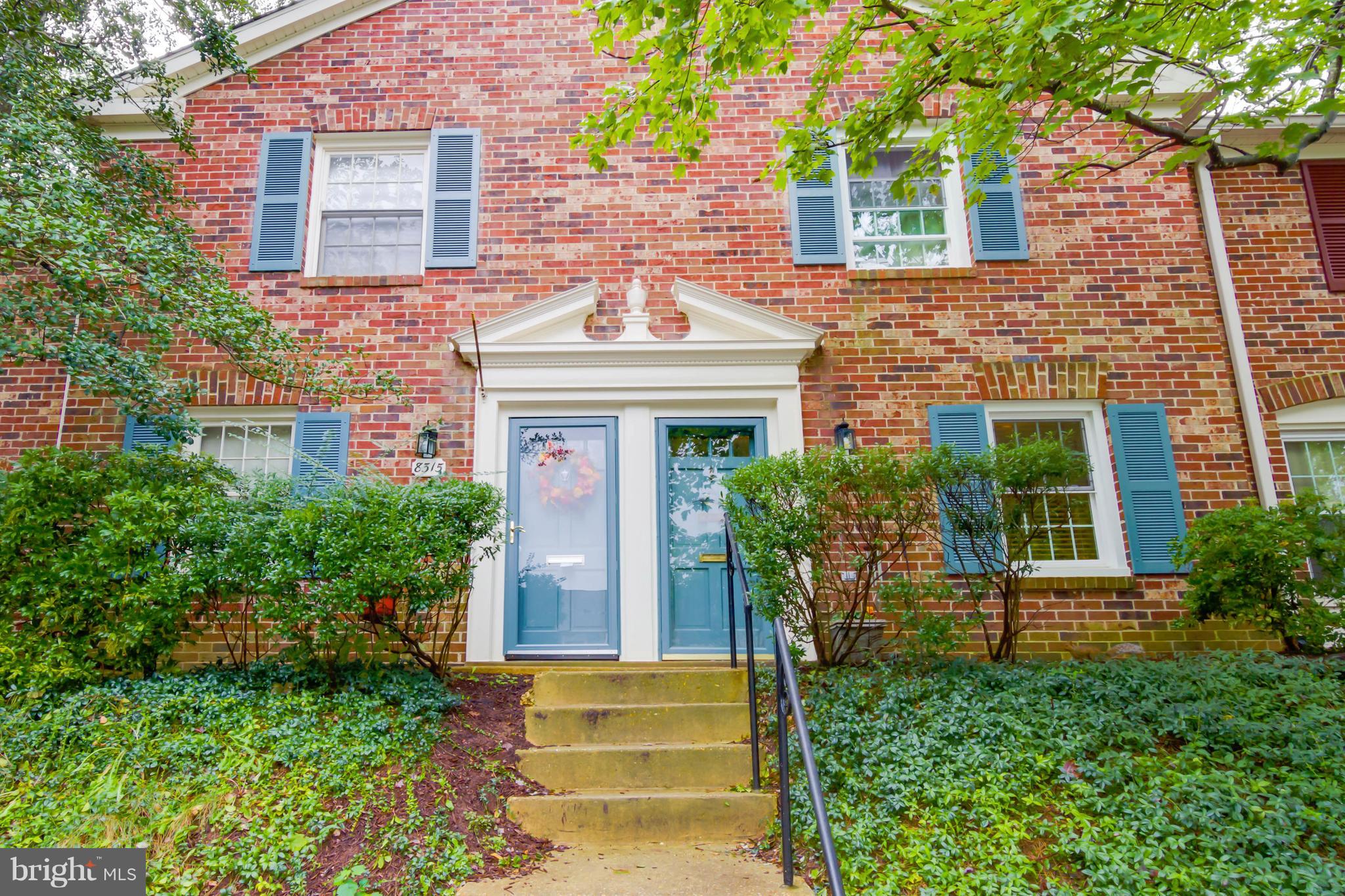 8317 Kingsgate Road, Unit 517 Springfield, VA 22152 - Photo 1 of 30 front view of a house with potted plants