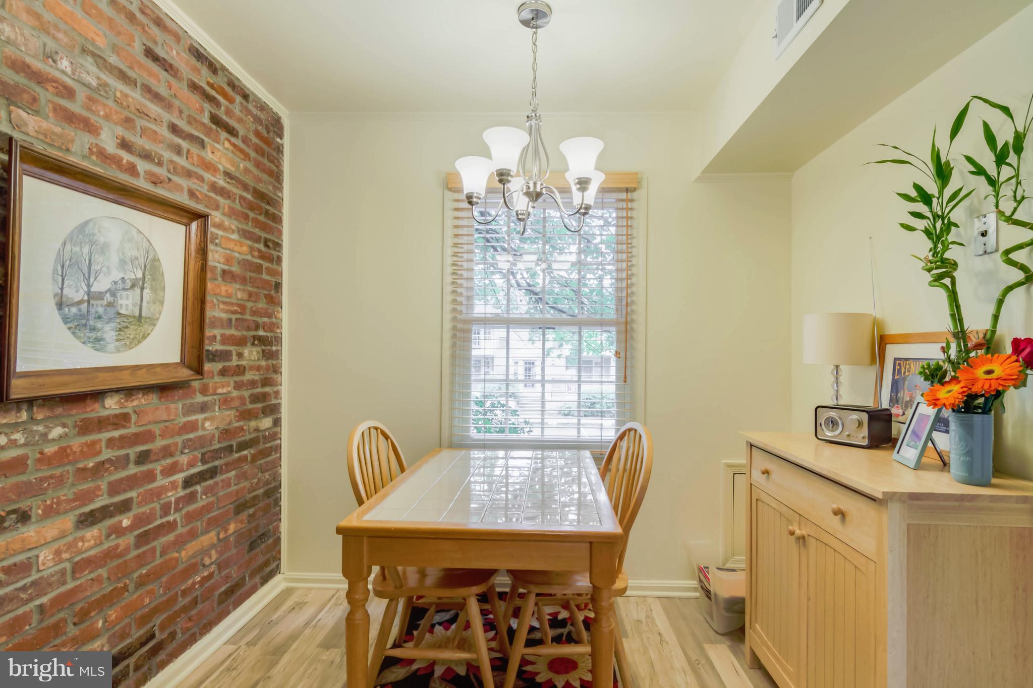 8317 Kingsgate Road, Unit 517 Springfield, VA 22152 - Photo 11 of 30 a dining room with furniture and window