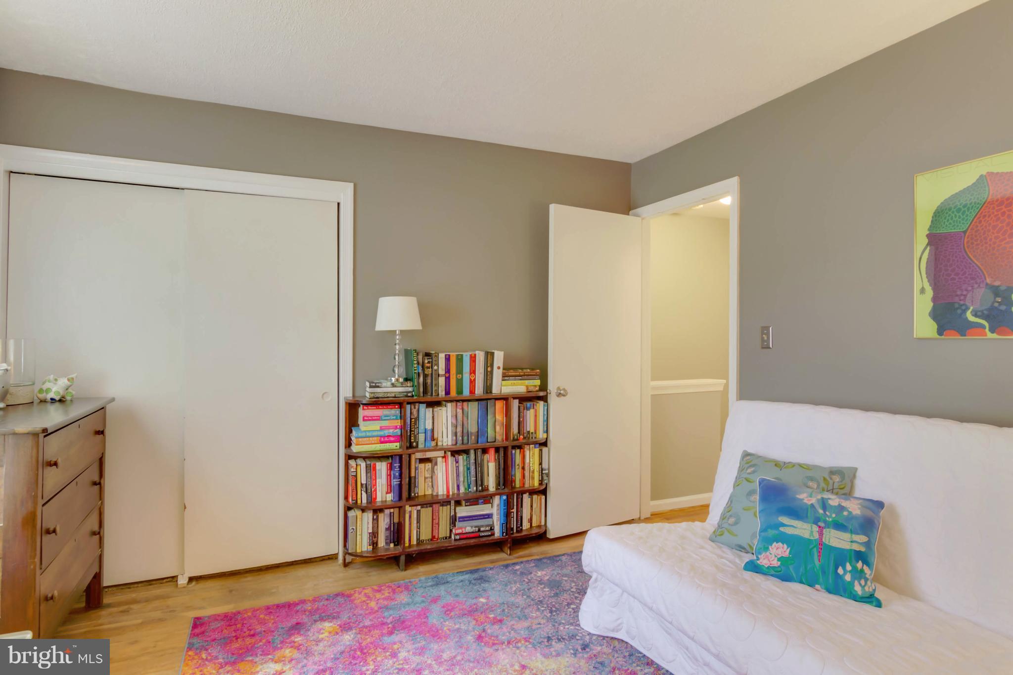 8317 Kingsgate Road, Unit 517 Springfield, VA 22152 - Photo 17 of 30 a living room with furniture and a book shelf