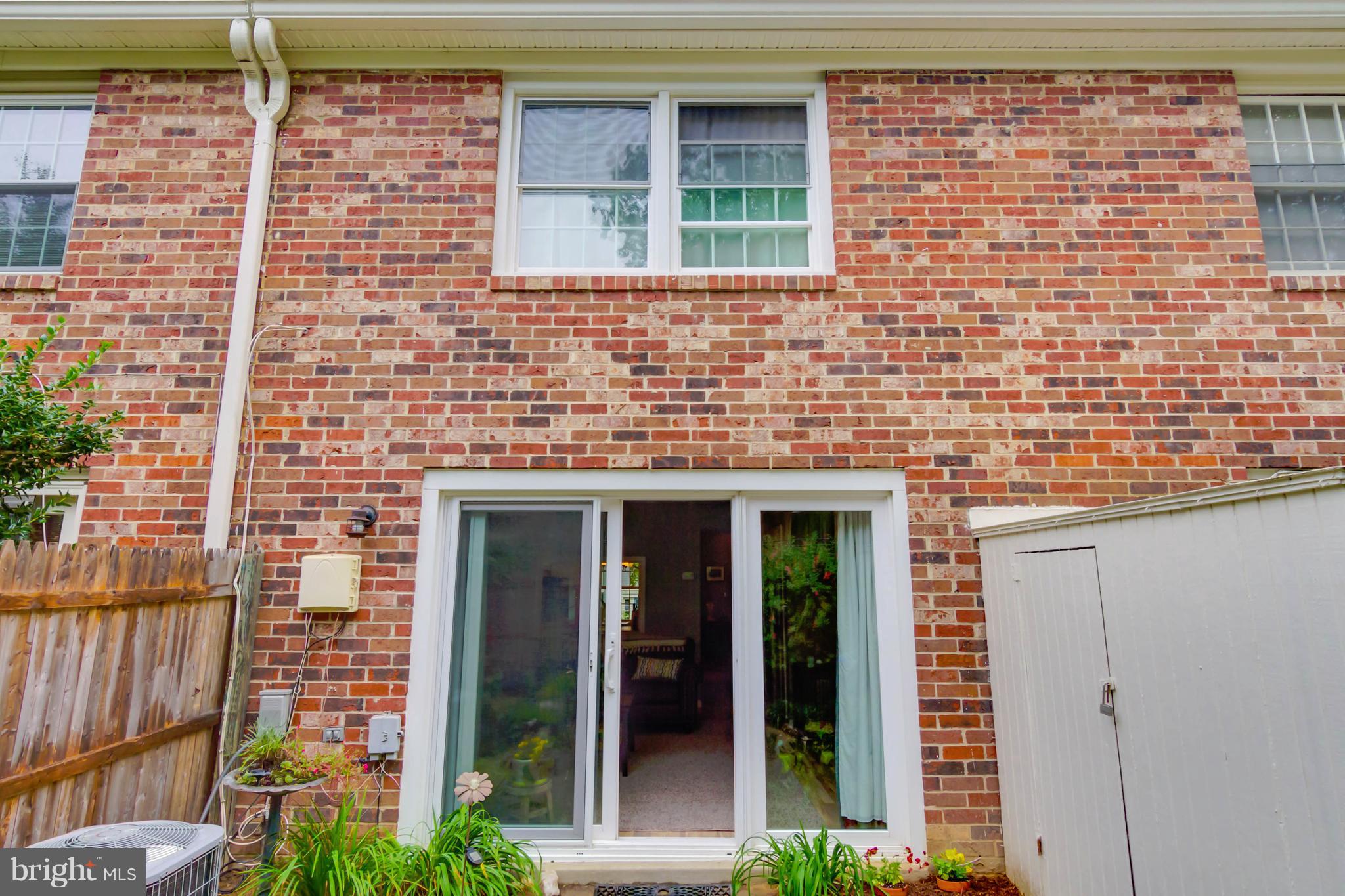 8317 Kingsgate Road, Unit 517 Springfield, VA 22152 - Photo 24 of 30 a brick house with a large windows