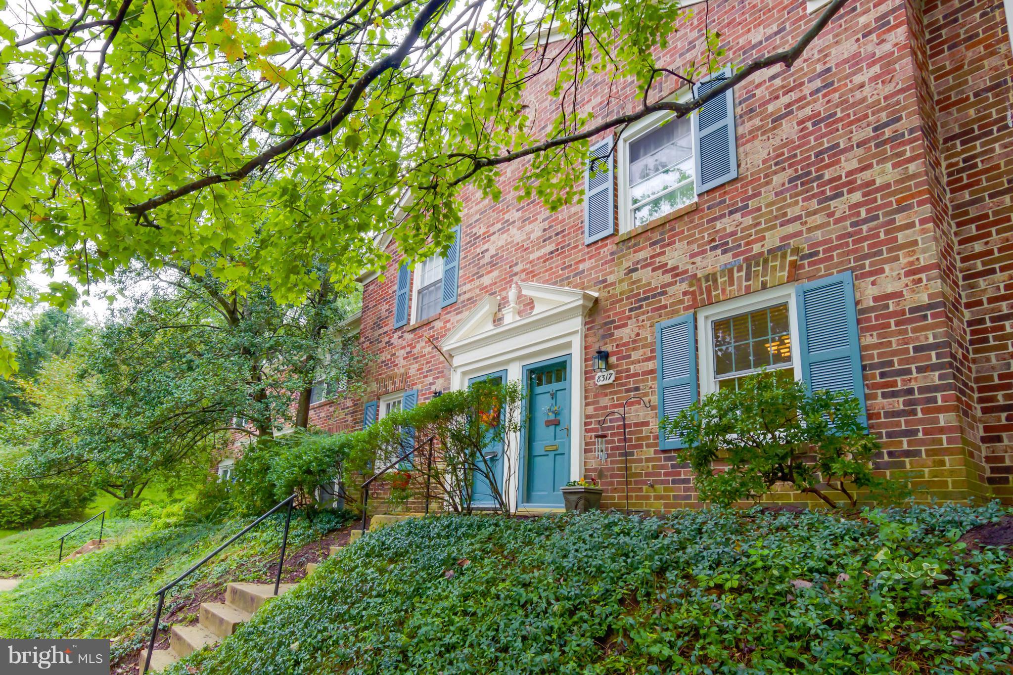 8317 Kingsgate Road, Unit 517 Springfield, VA 22152 - Photo 26 of 30 front view of a brick house with a small yard