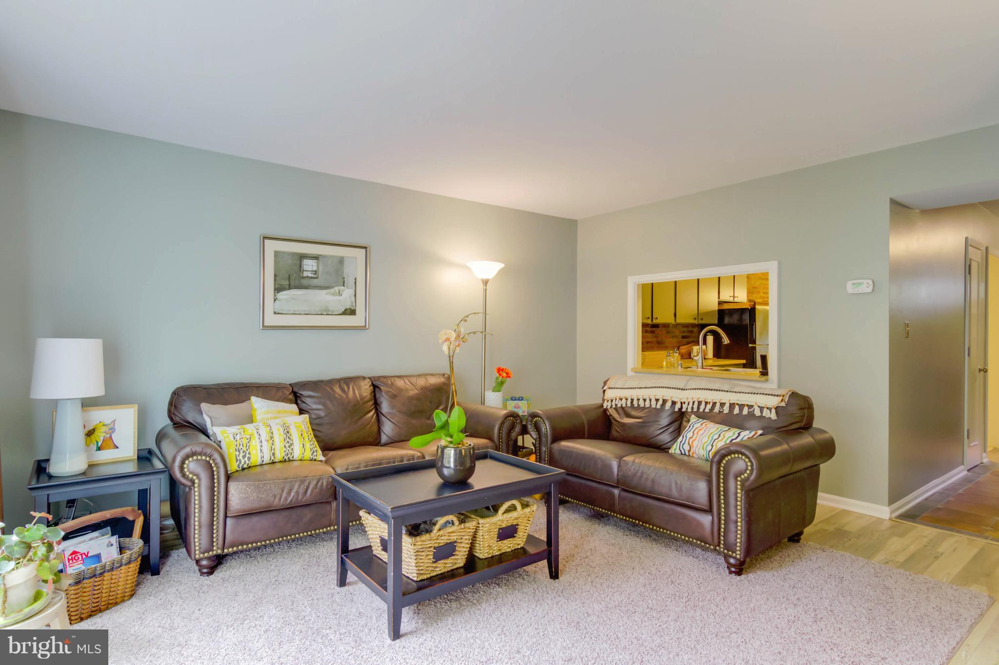 8317 Kingsgate Road, Unit 517 Springfield, VA 22152 - Photo 5 of 30 a living room with furniture and a couch