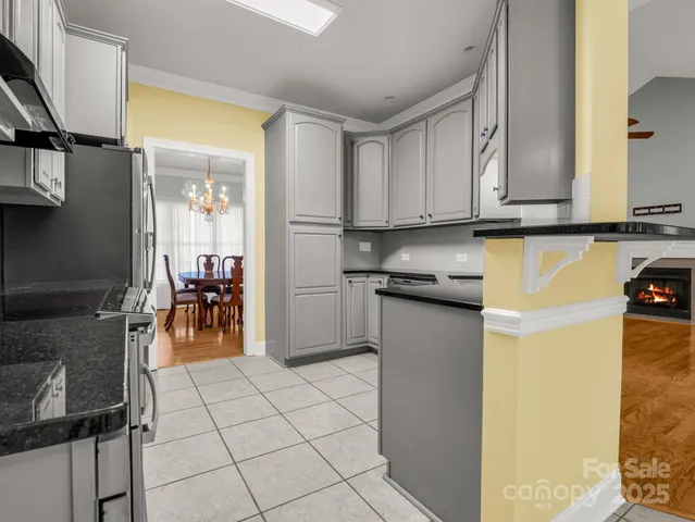 a kitchen with a refrigerator and cabinets