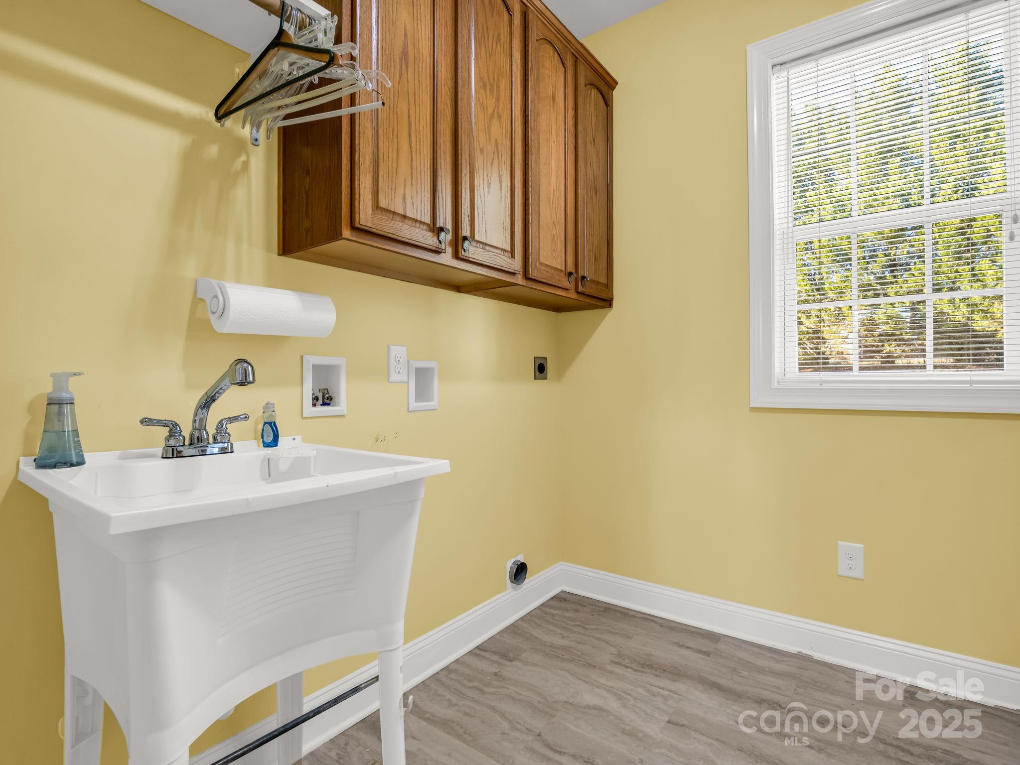 757 Smith Grove Road Forest City, NC 28043 - Photo 29 of 46 a bathroom with a sink a mirror and a toilet