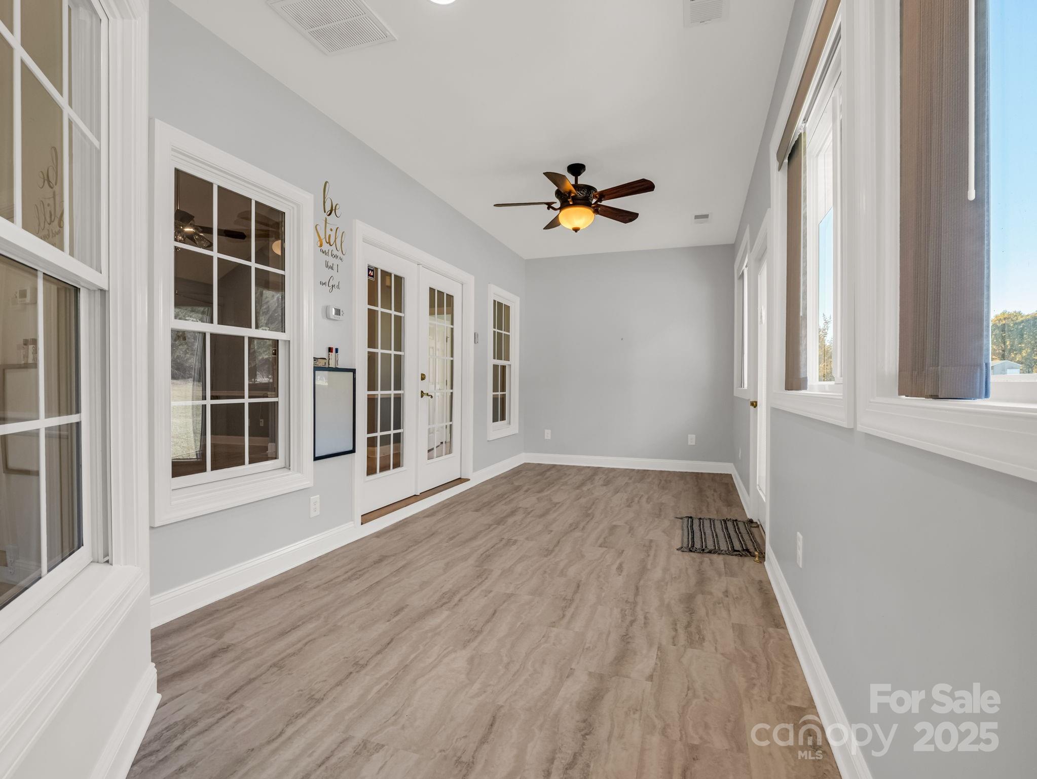 757 Smith Grove Road Forest City, NC 28043 - Photo 34 of 46 a view of an empty room with a window and wooden floor