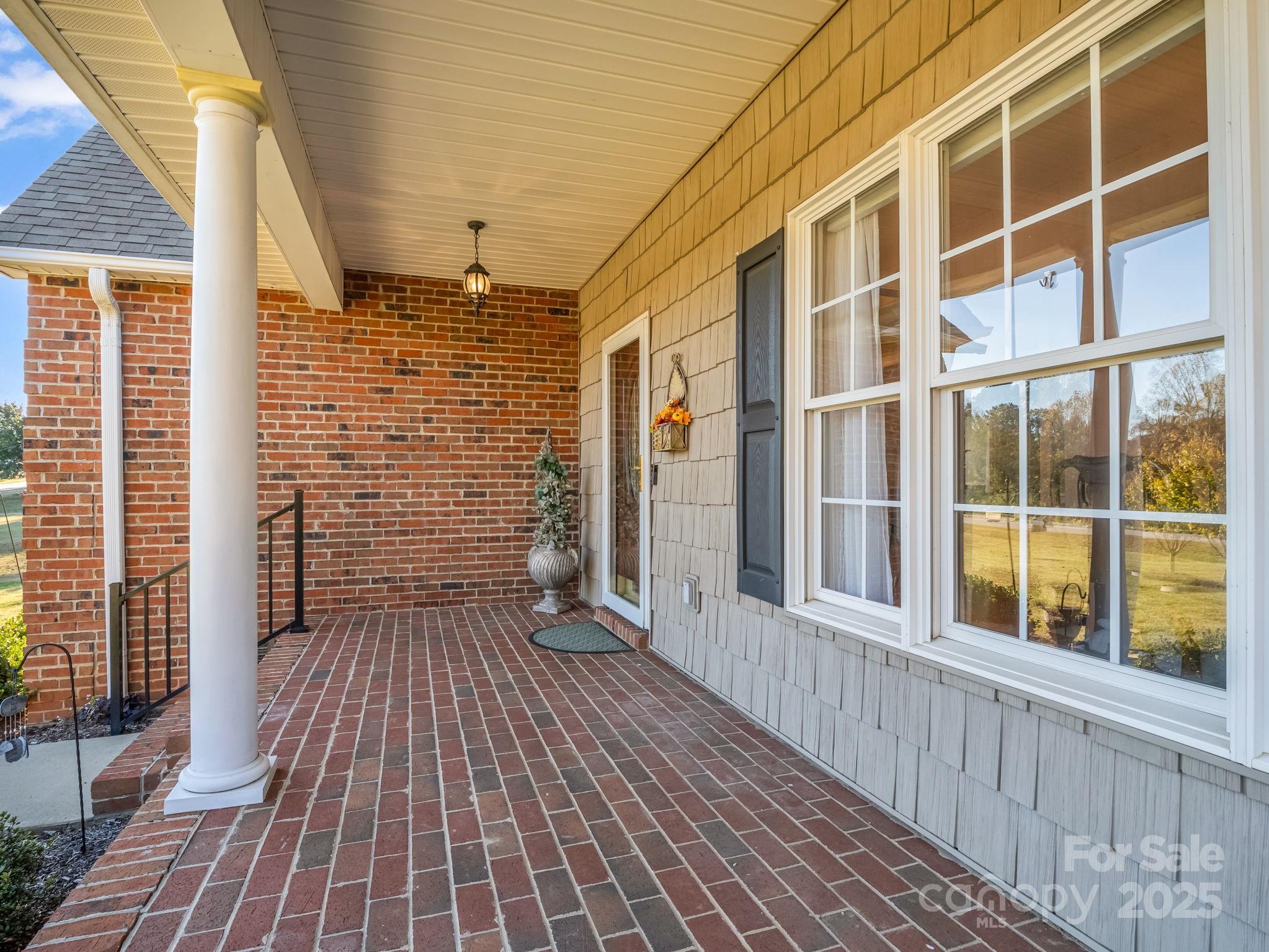 757 Smith Grove Road Forest City, NC 28043 - Photo 37 of 46 a view of a balcony with wooden floor and iron stairs