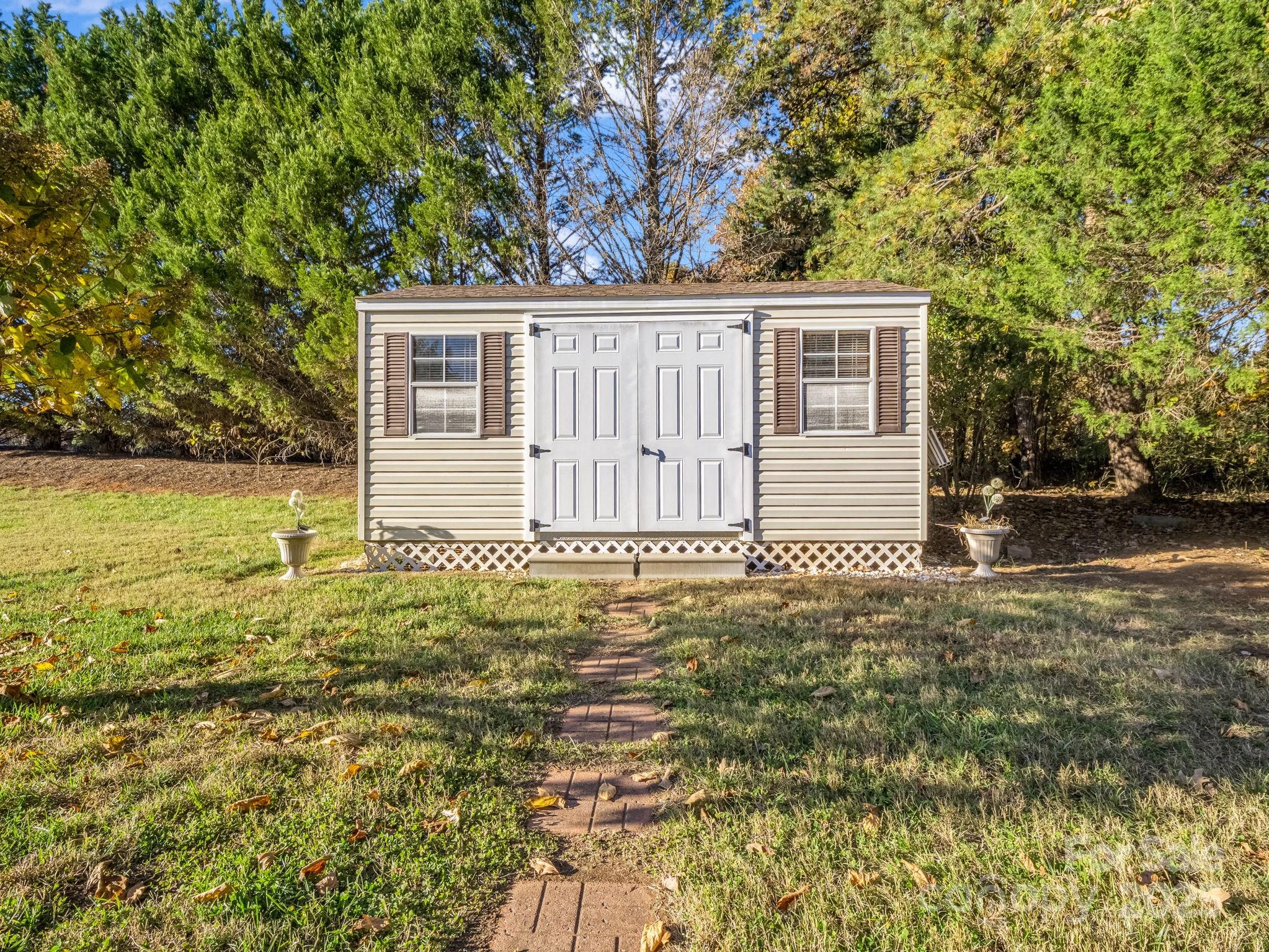 757 Smith Grove Road Forest City, NC 28043 - Photo 45 of 46 a front view of a house with a garden