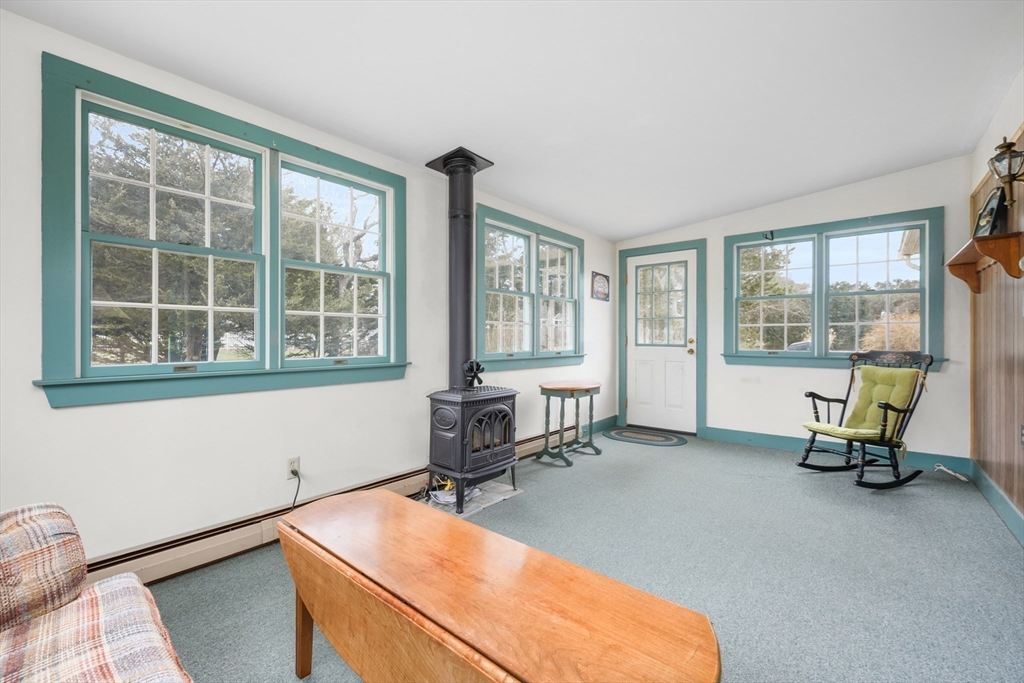 35 Wiley Lane Eastham, MA 02642 - Photo 15 of 38 a room with chair and windows