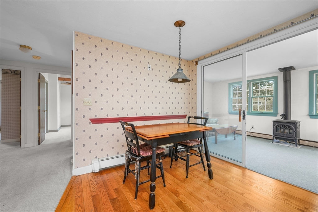 35 Wiley Lane Eastham, MA 02642 - Photo 16 of 38 a patio with a table and chairs
