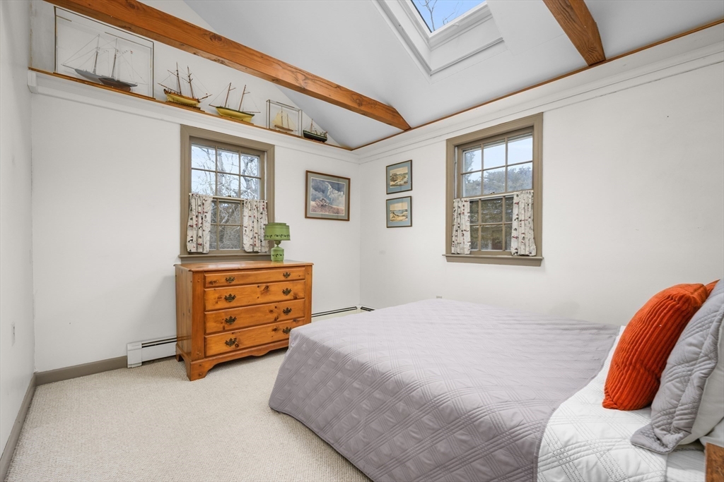 35 Wiley Lane Eastham, MA 02642 - Photo 18 of 38 a bedroom with furniture and a window