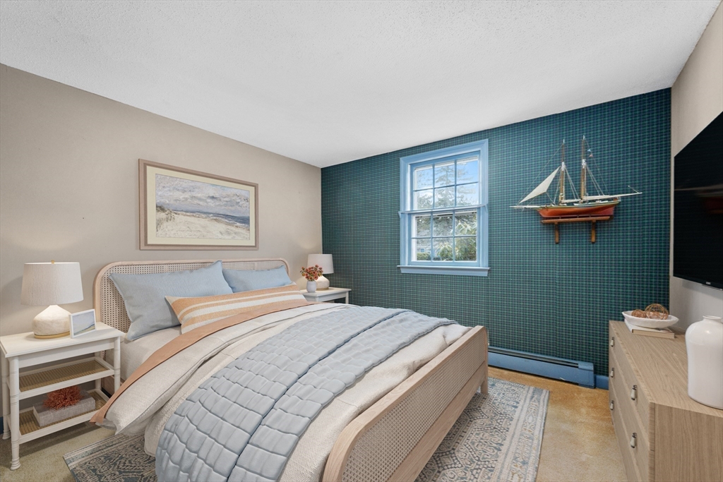 35 Wiley Lane Eastham, MA 02642 - Photo 24 of 38 a bedroom with a bed and a window