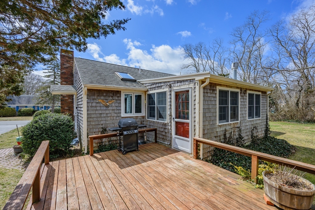 35 Wiley Lane Eastham, MA 02642 - Photo 32 of 38 a view of house with deck and outdoor seating