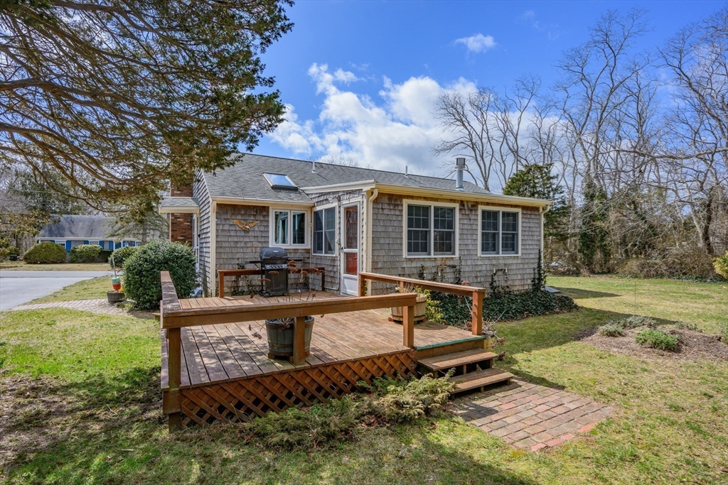 35 Wiley Lane Eastham, MA 02642 - Photo 4 of 38 front view of a house with a yard