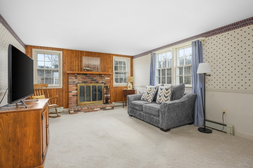 35 Wiley Lane Eastham, MA 02642 - Photo 9 of 38 a living room with furniture and a flat screen tv