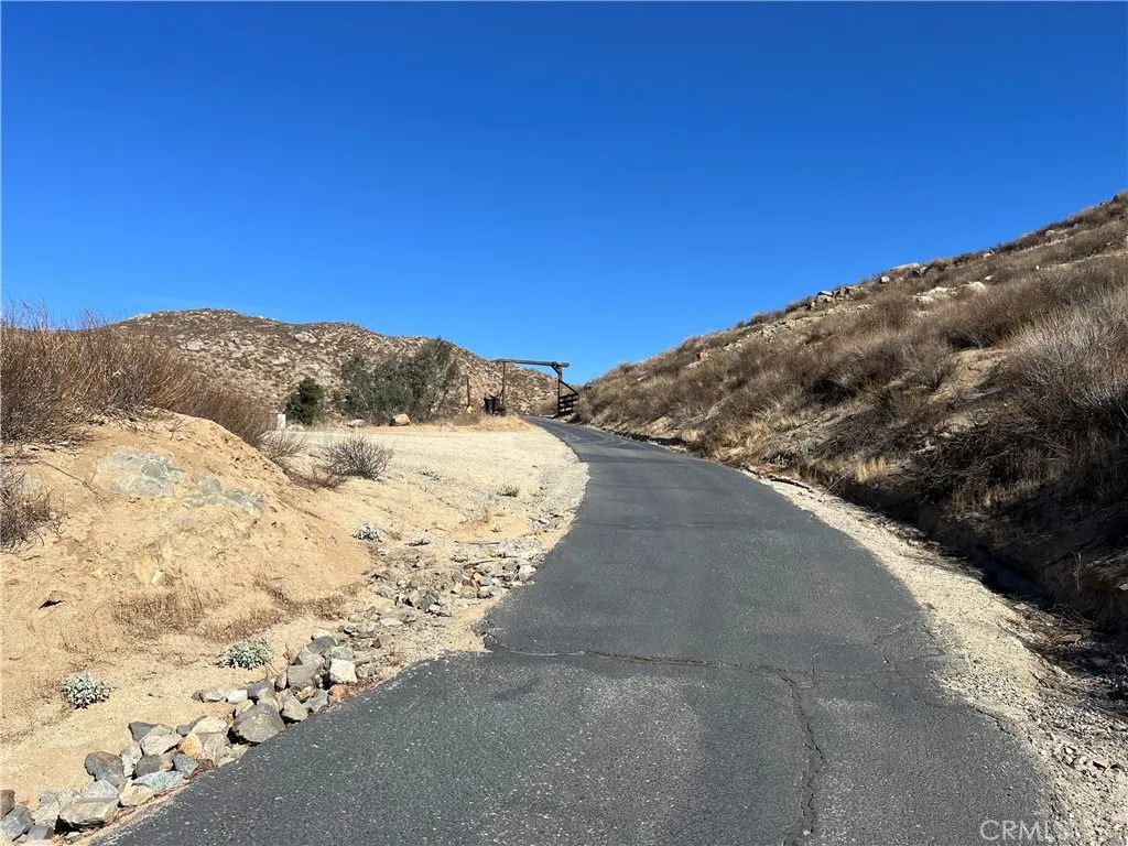 0 Ano Crest Road Winchester, CA 92596 - Photo 18 of 19 a view of a dry yard with mountains in the background