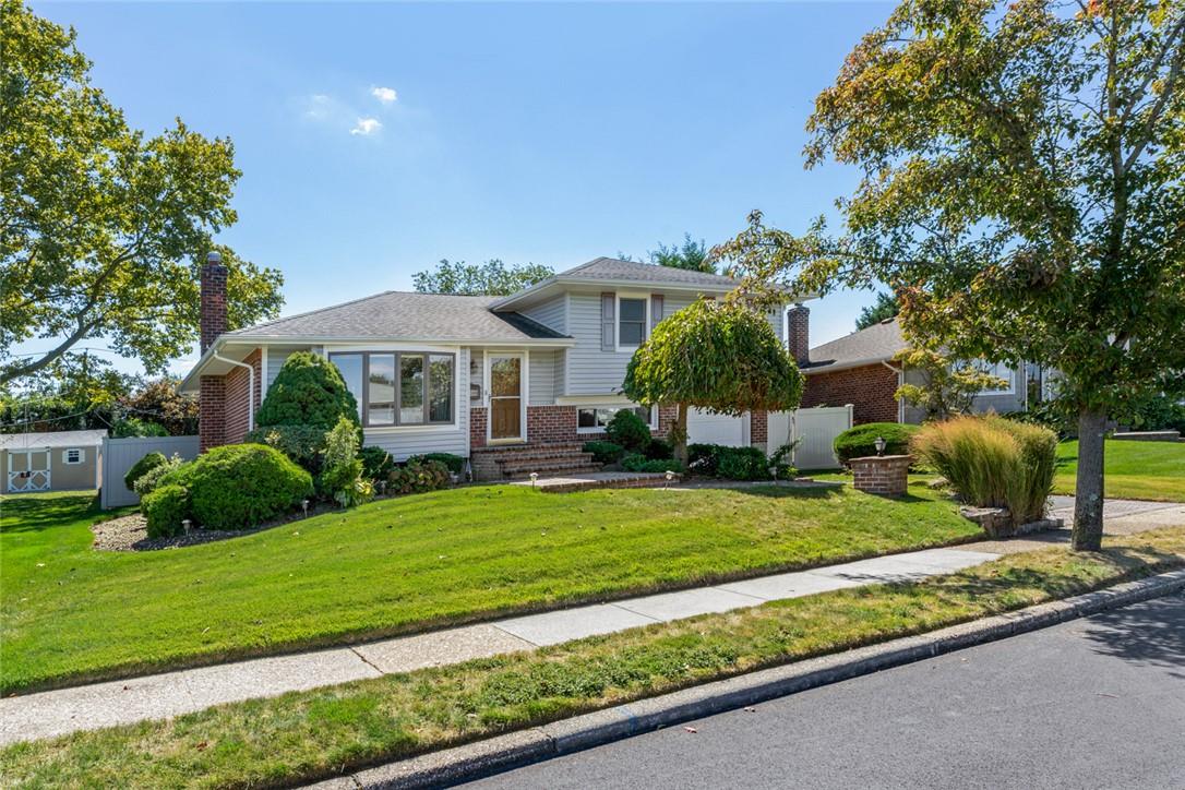 a front view of a house with a yard table and chairs