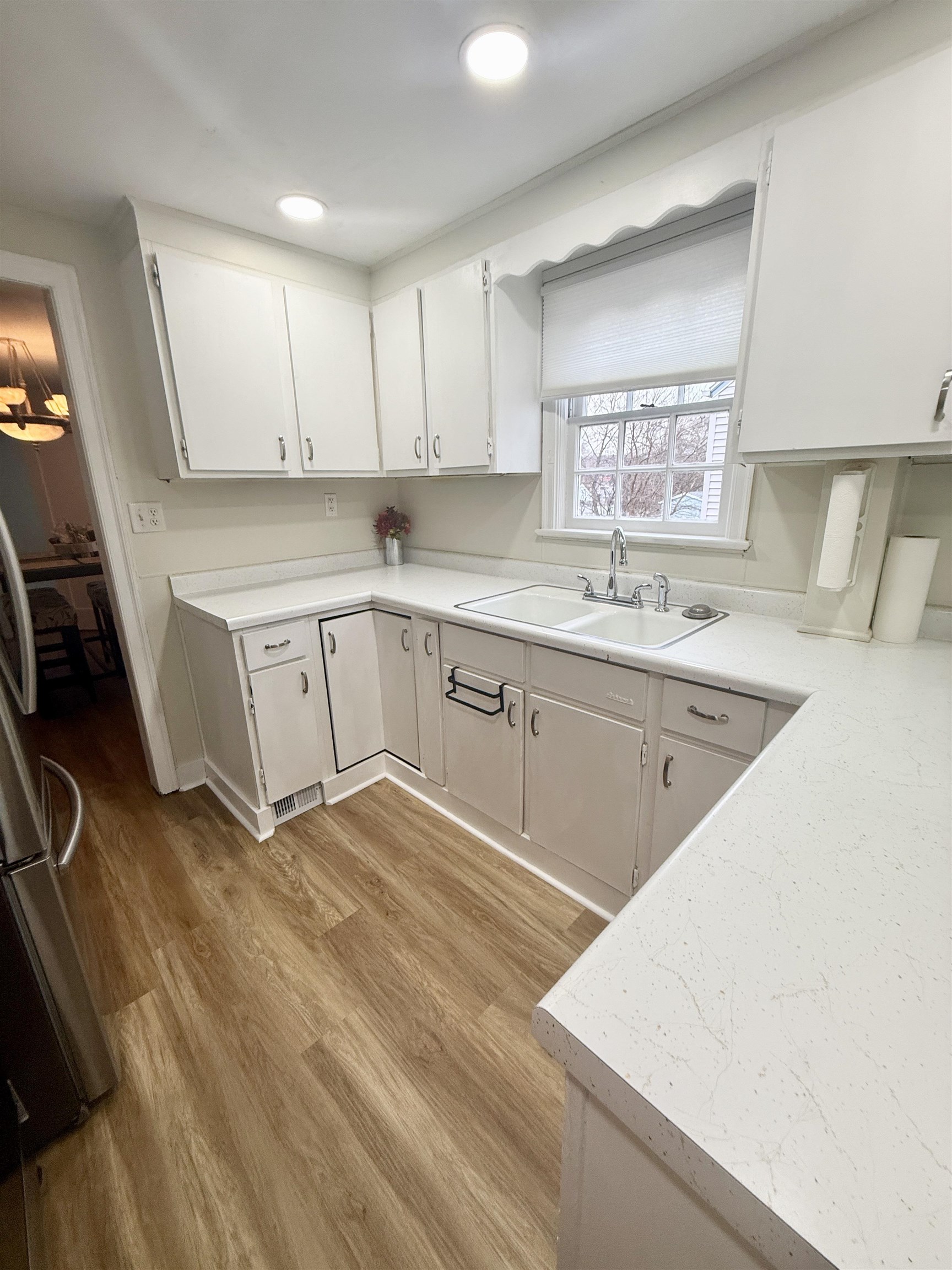 401 Junius Street Loves Park, IL 61111 - Photo 13 of 33 a kitchen with a sink stove and cabinets