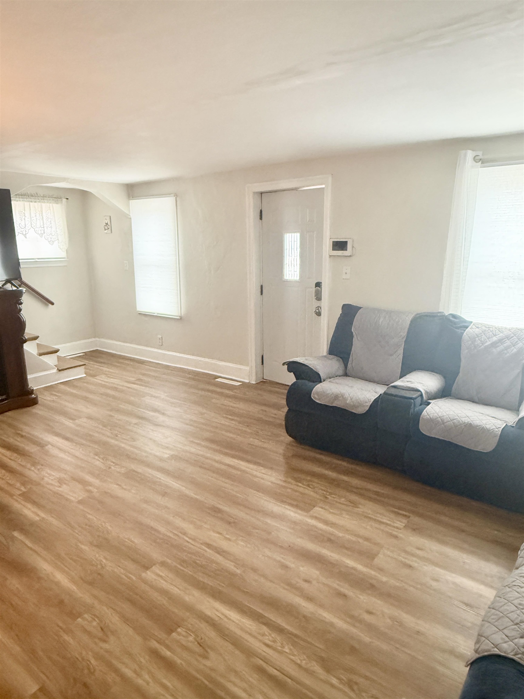 401 Junius Street Loves Park, IL 61111 - Photo 7 of 33 a living room with furniture and a wooden floor