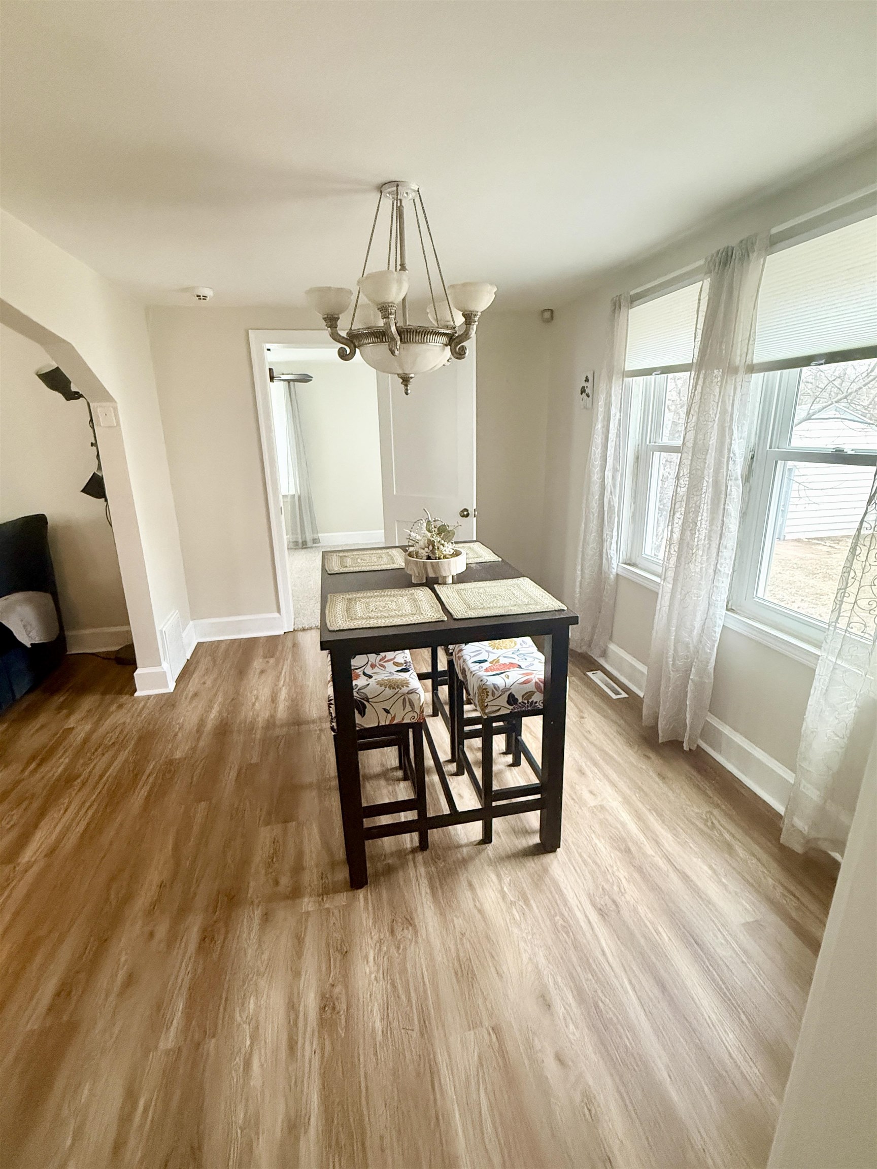 401 Junius Street Loves Park, IL 61111 - Photo 10 of 33 a view of a dining room with furniture wooden floor and chandelier