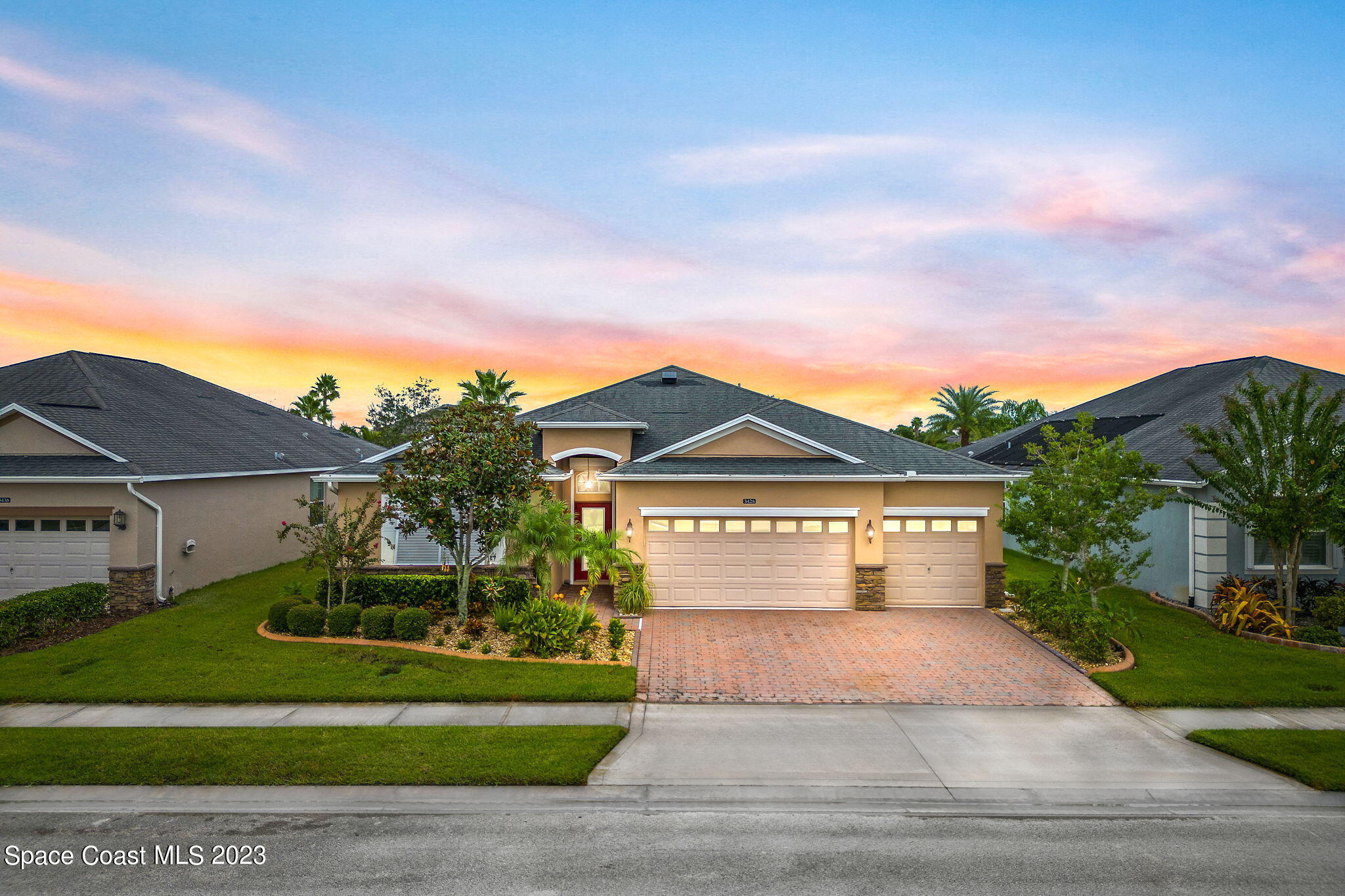a front view of a house with a yard