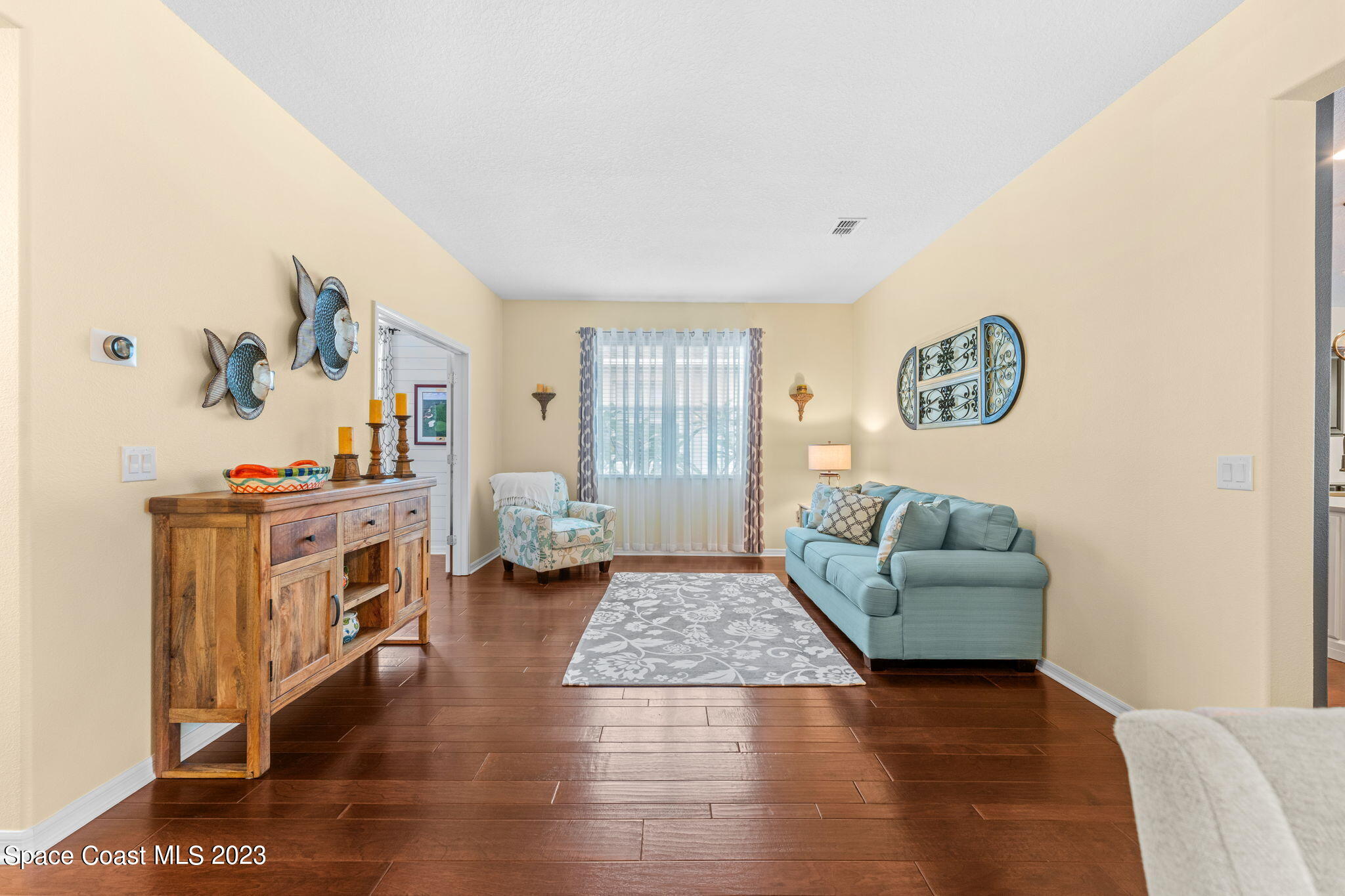 3428 Ahern Place Melbourne, FL 32940 - Photo 11 of 64 a living room with furniture and a table