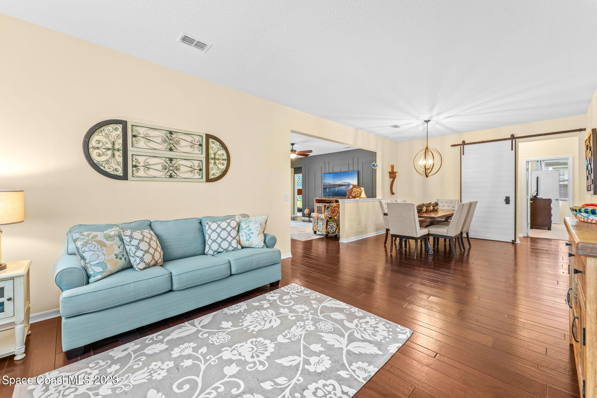 3428 Ahern Place Melbourne, FL 32940 - Photo 12 of 64 a living room with furniture and wooden floor