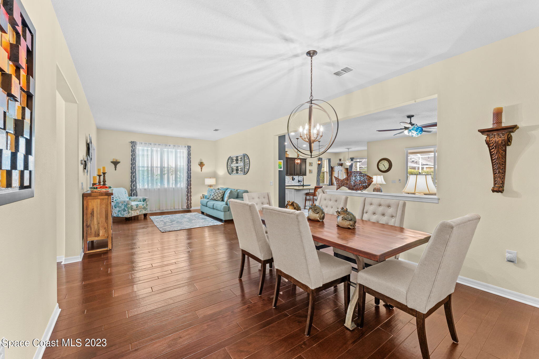3428 Ahern Place Melbourne, FL 32940 - Photo 13 of 64 a view of a dining room with furniture window and wooden floor