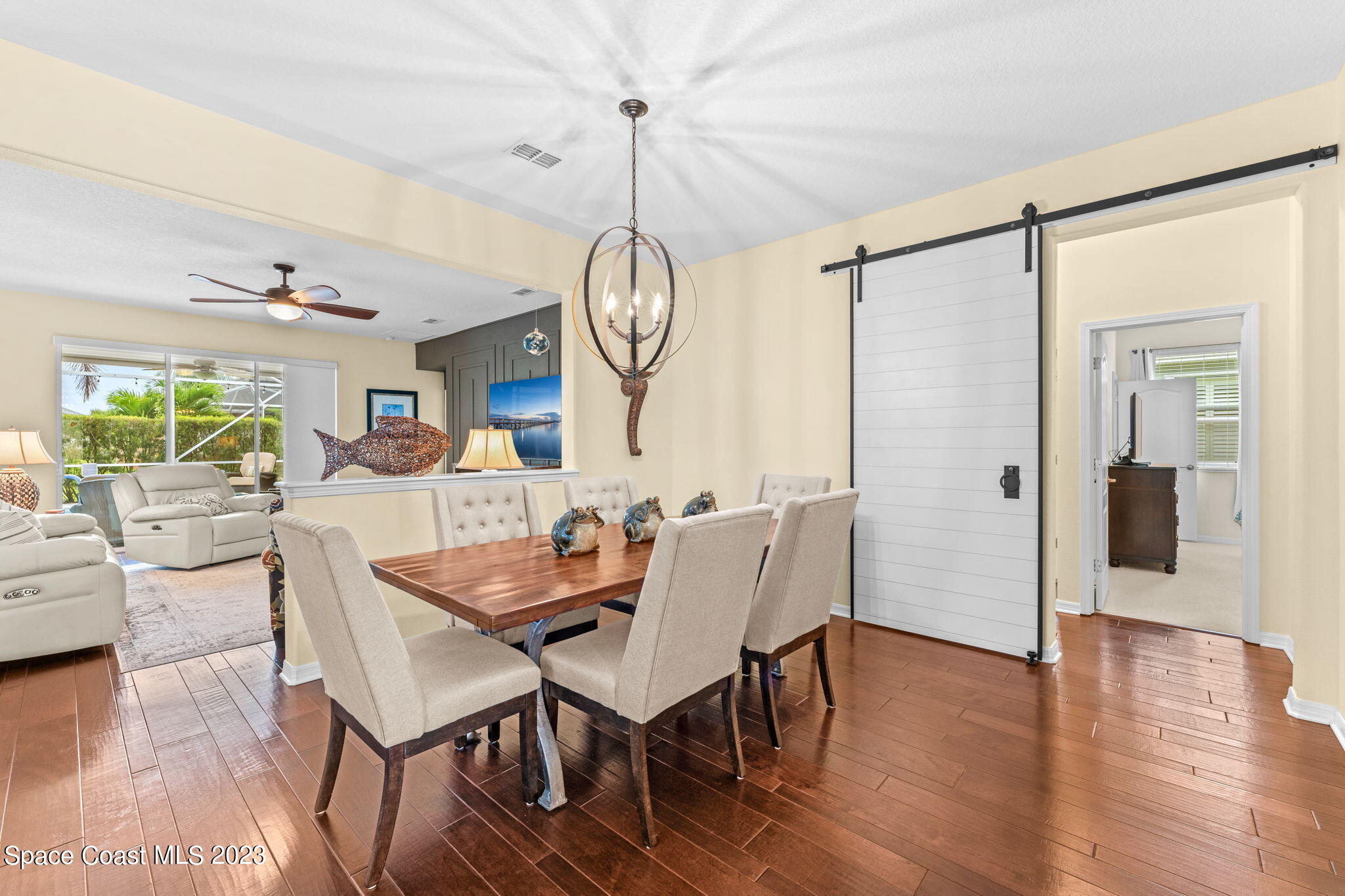 3428 Ahern Place Melbourne, FL 32940 - Photo 14 of 64 a view of a dining room with furniture window and wooden floor