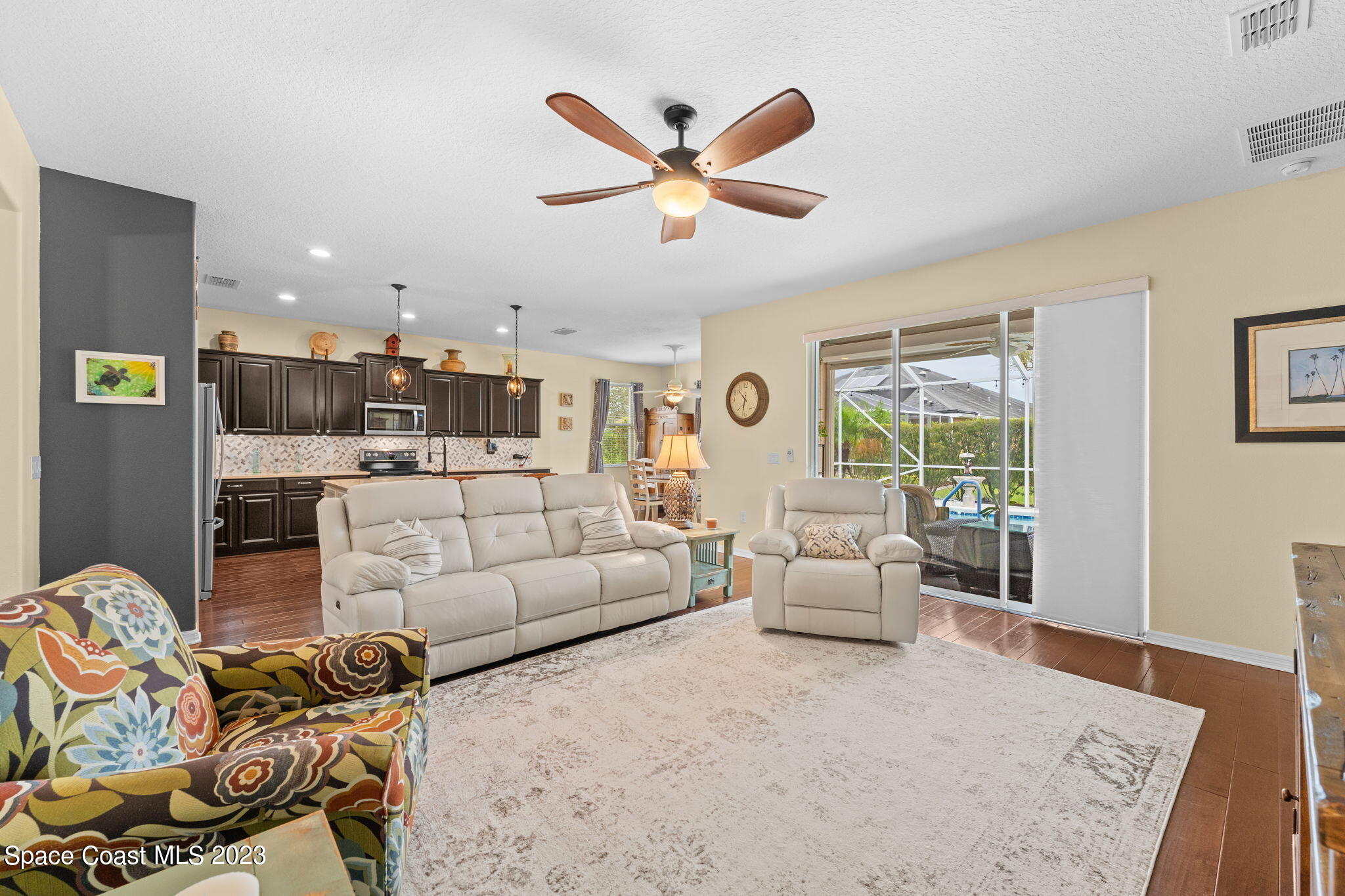 3428 Ahern Place Melbourne, FL 32940 - Photo 17 of 64 a living room with furniture and kitchen view