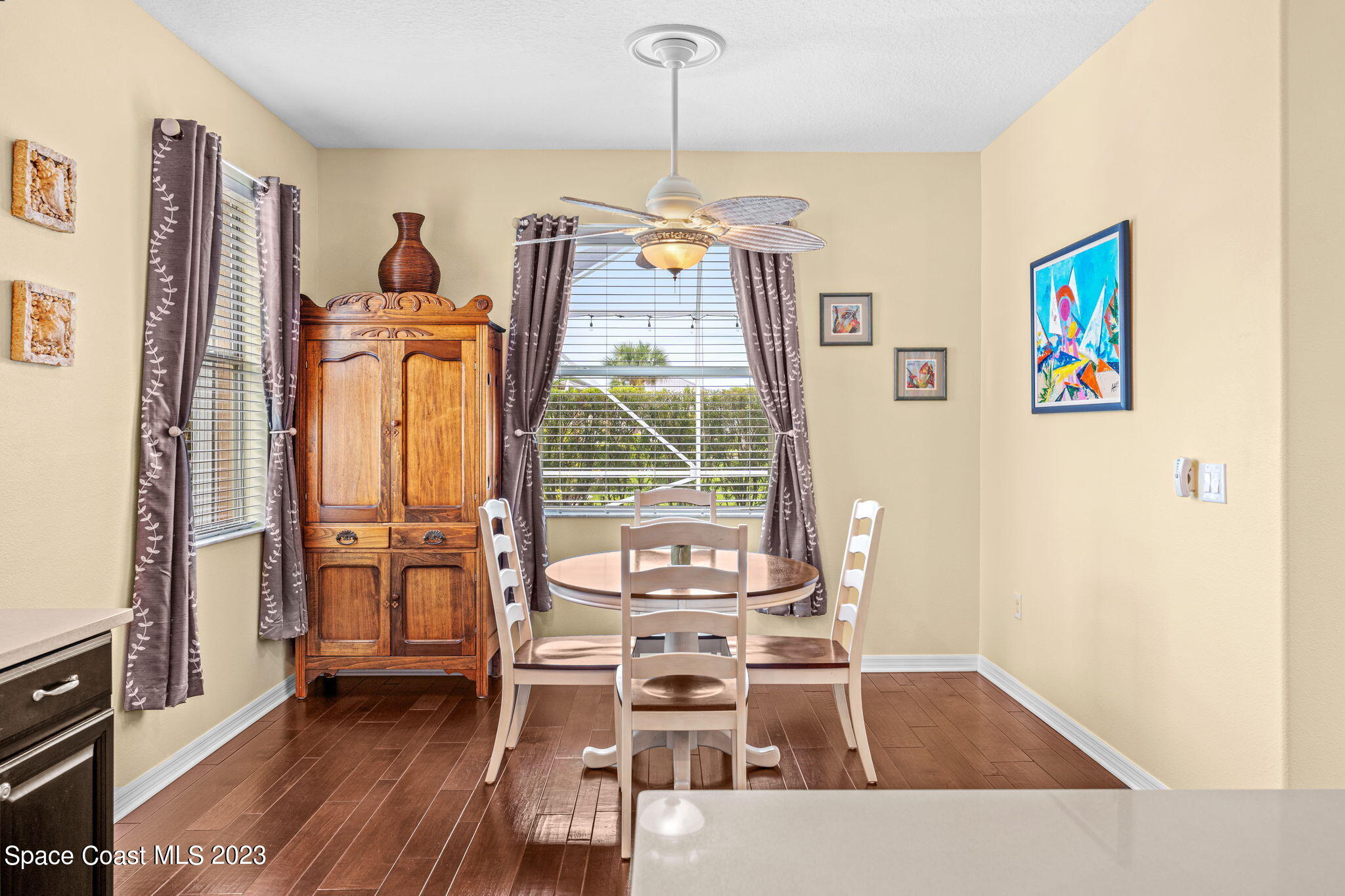 3428 Ahern Place Melbourne, FL 32940 - Photo 27 of 64 a view of a dining room with furniture window and wooden floor