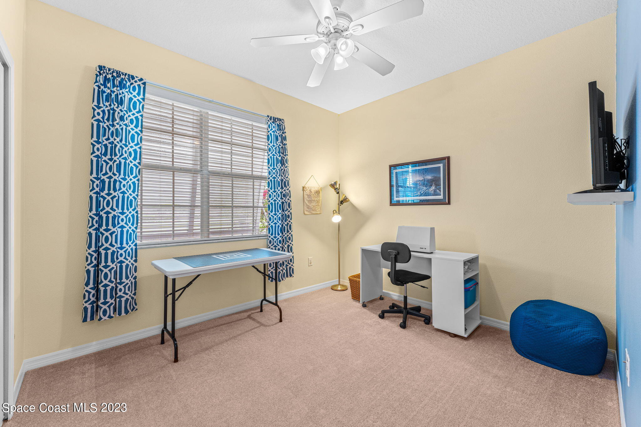 3428 Ahern Place Melbourne, FL 32940 - Photo 35 of 64 a view of a workspace with furniture and a window