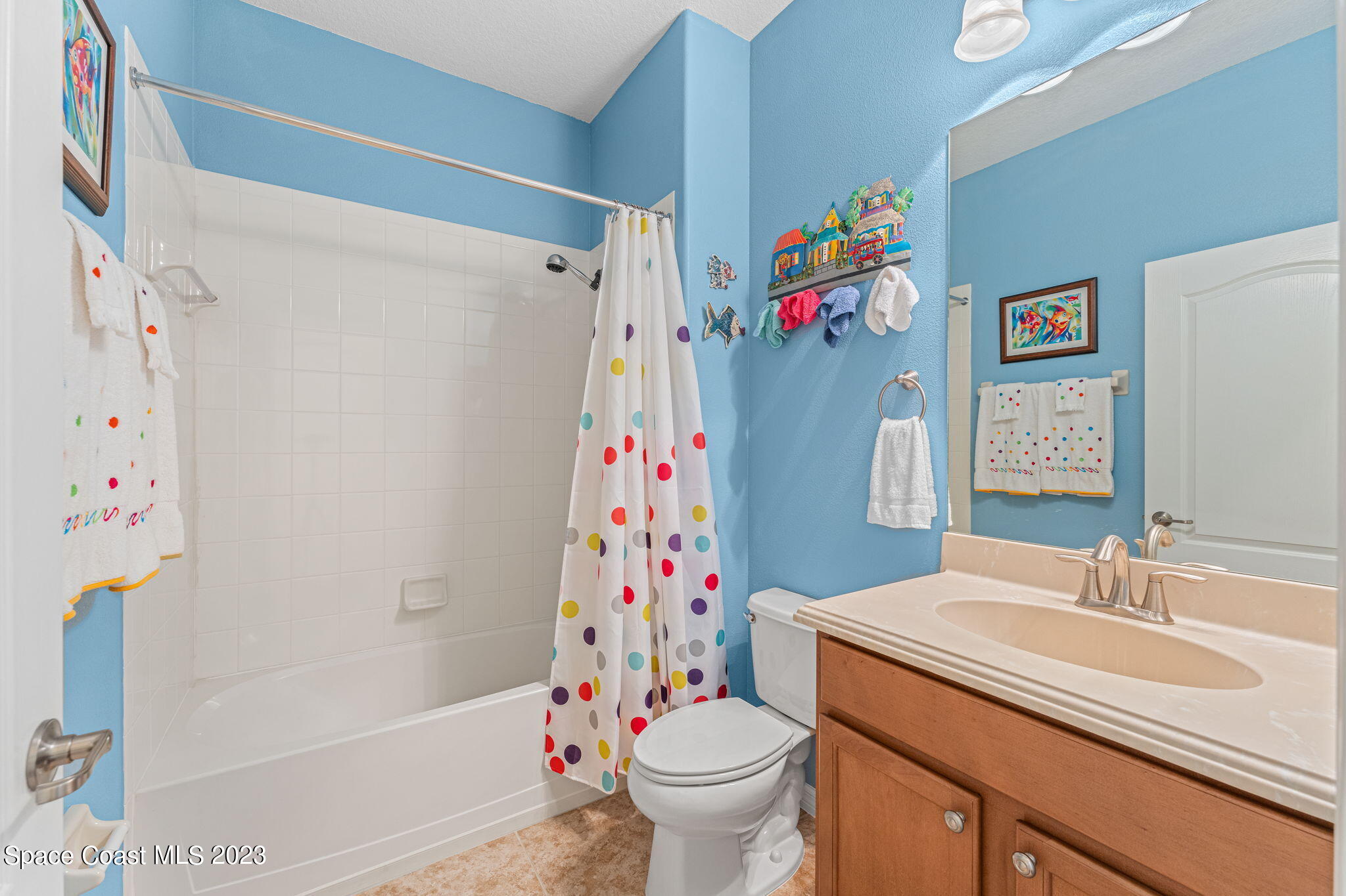 3428 Ahern Place Melbourne, FL 32940 - Photo 36 of 64 a bathroom with a sink toilet and shower