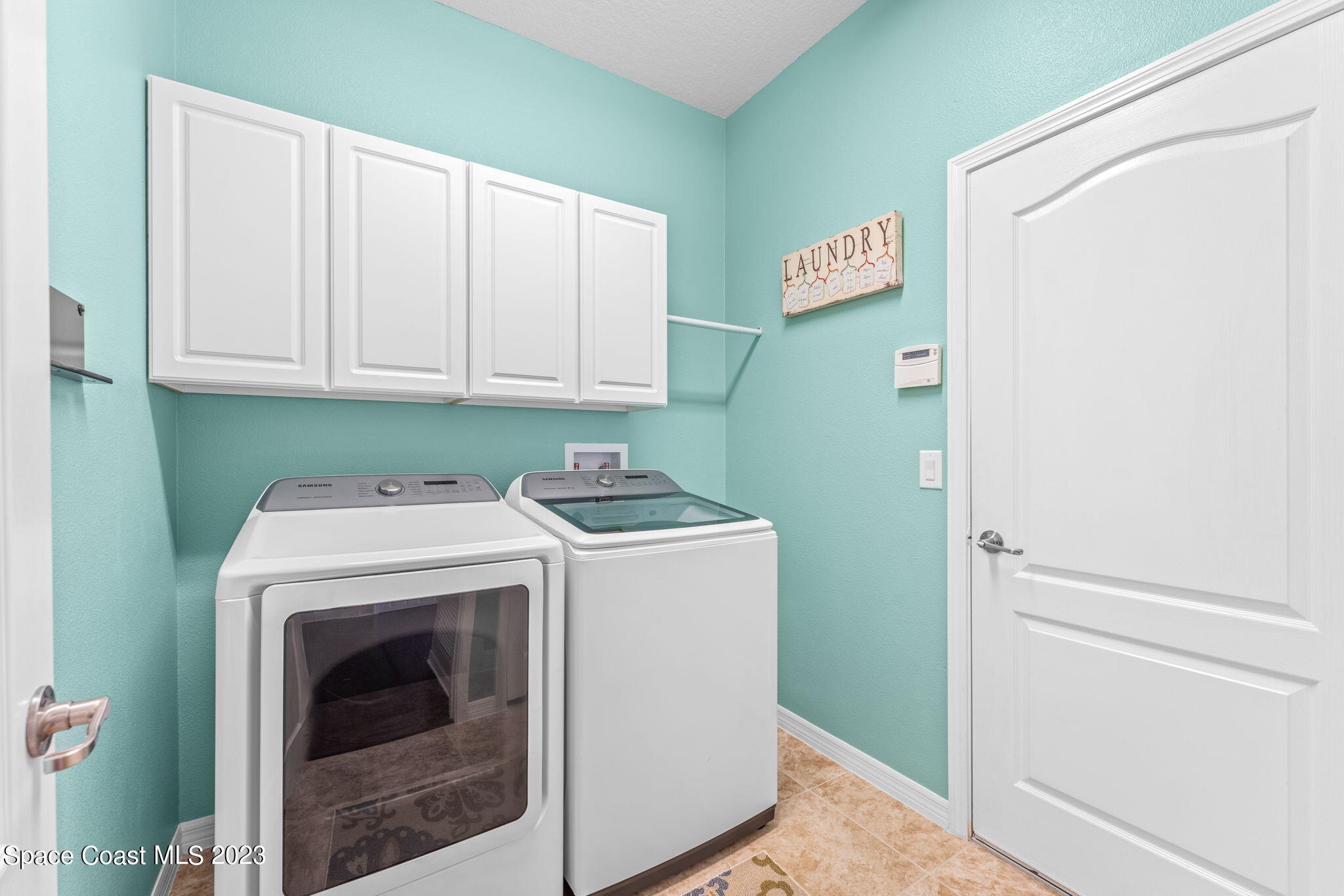 3428 Ahern Place Melbourne, FL 32940 - Photo 37 of 64 a utility room with dryer and washer