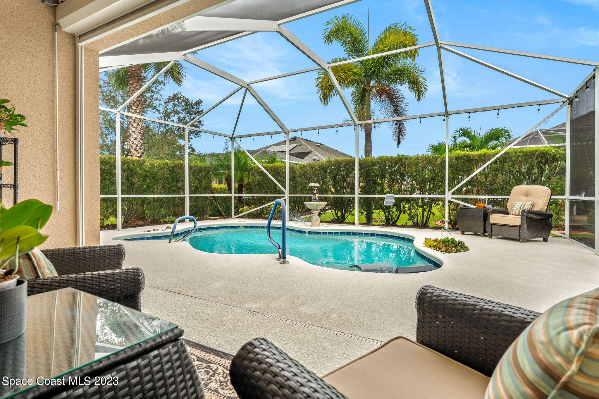 3428 Ahern Place Melbourne, FL 32940 - Photo 40 of 64 a view of backyard with swimming pool and outdoor seating