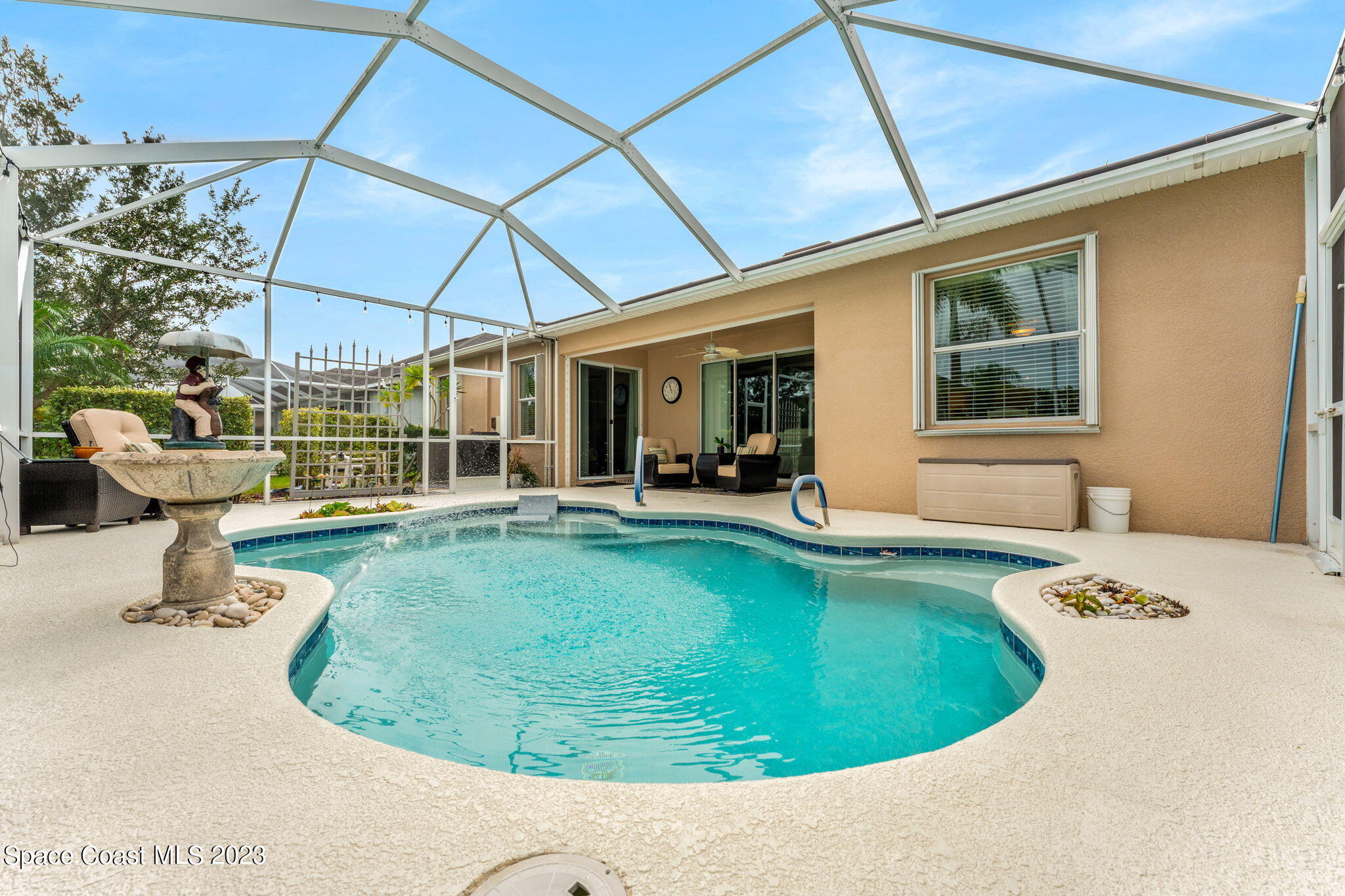 3428 Ahern Place Melbourne, FL 32940 - Photo 42 of 64 a view of a swimming pool with seating area