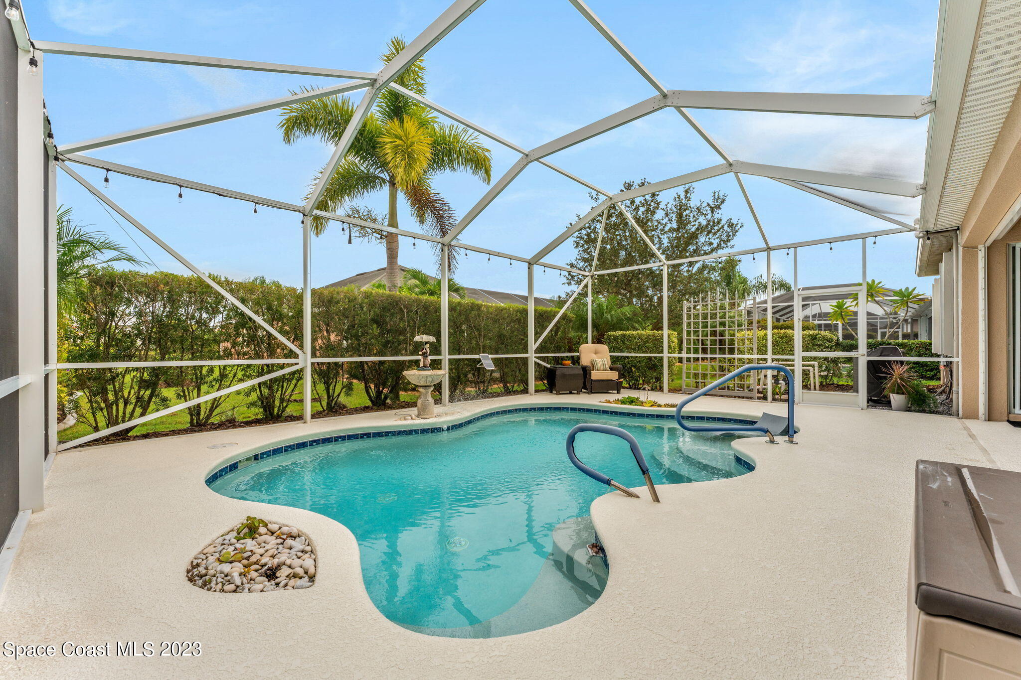 3428 Ahern Place Melbourne, FL 32940 - Photo 43 of 64 a view of a house with a swimming pool