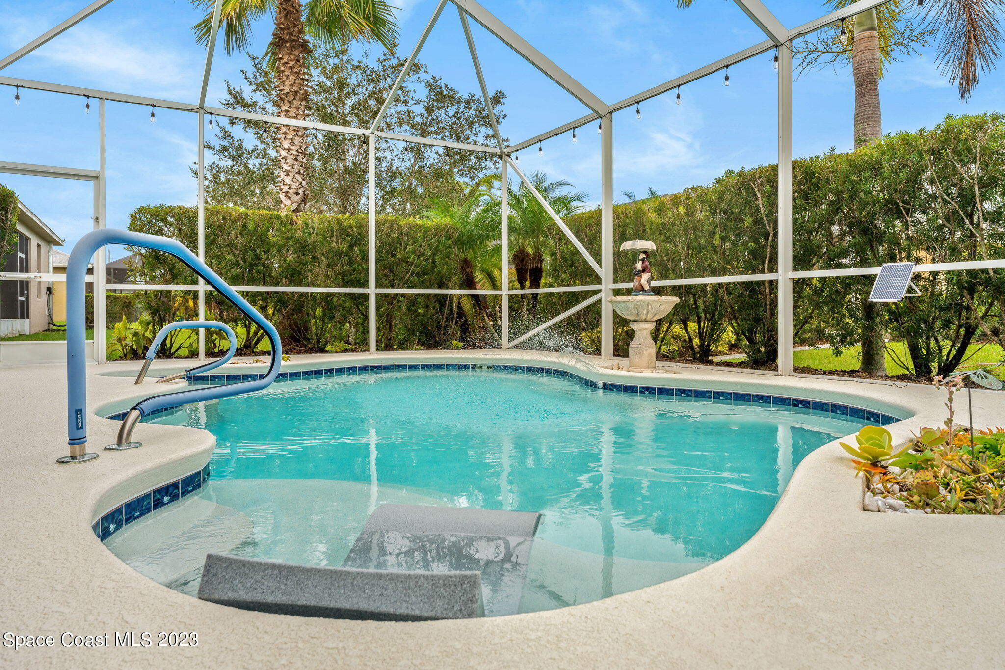 3428 Ahern Place Melbourne, FL 32940 - Photo 44 of 64 a view of a swimming pool with a porch