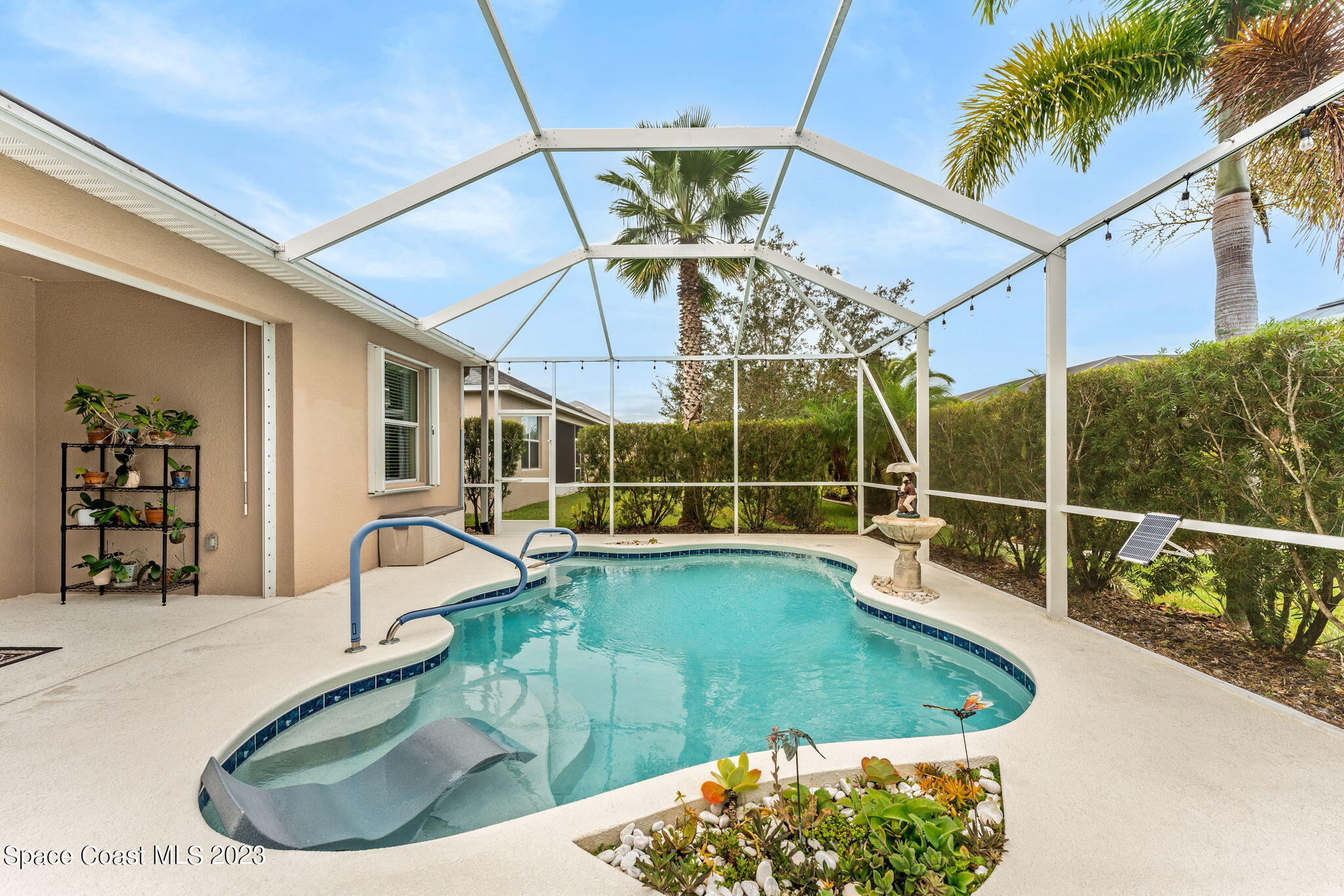 3428 Ahern Place Melbourne, FL 32940 - Photo 45 of 64 a view of a swimming pool with a patio