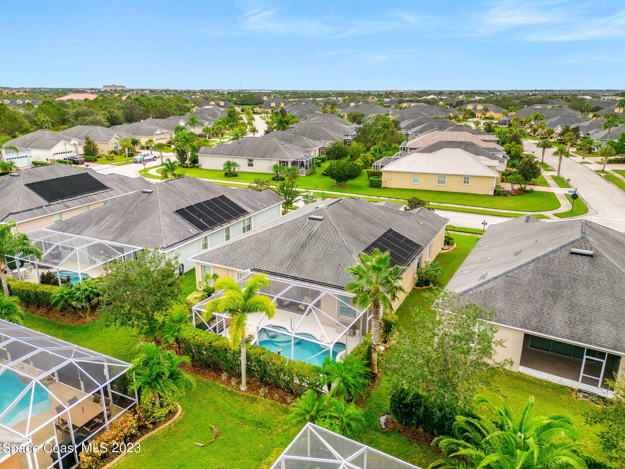 3428 Ahern Place Melbourne, FL 32940 - Photo 47 of 64 an aerial view of a house with a garden
