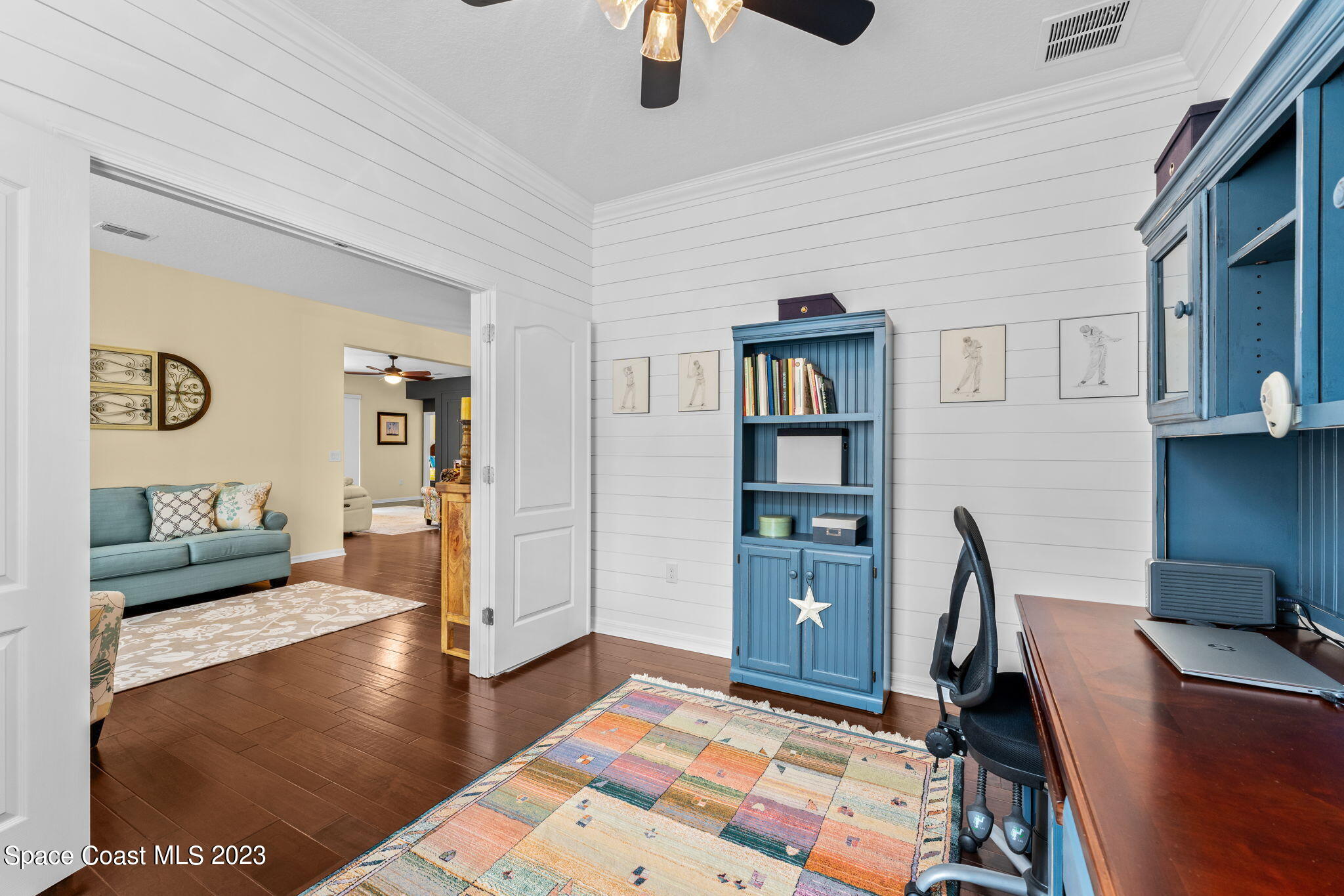 3428 Ahern Place Melbourne, FL 32940 - Photo 9 of 64 a bedroom with furniture and a book shelf